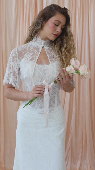 Bride wearing the Dalia lace topper with soft sleeves and vintage-inspired detailing.