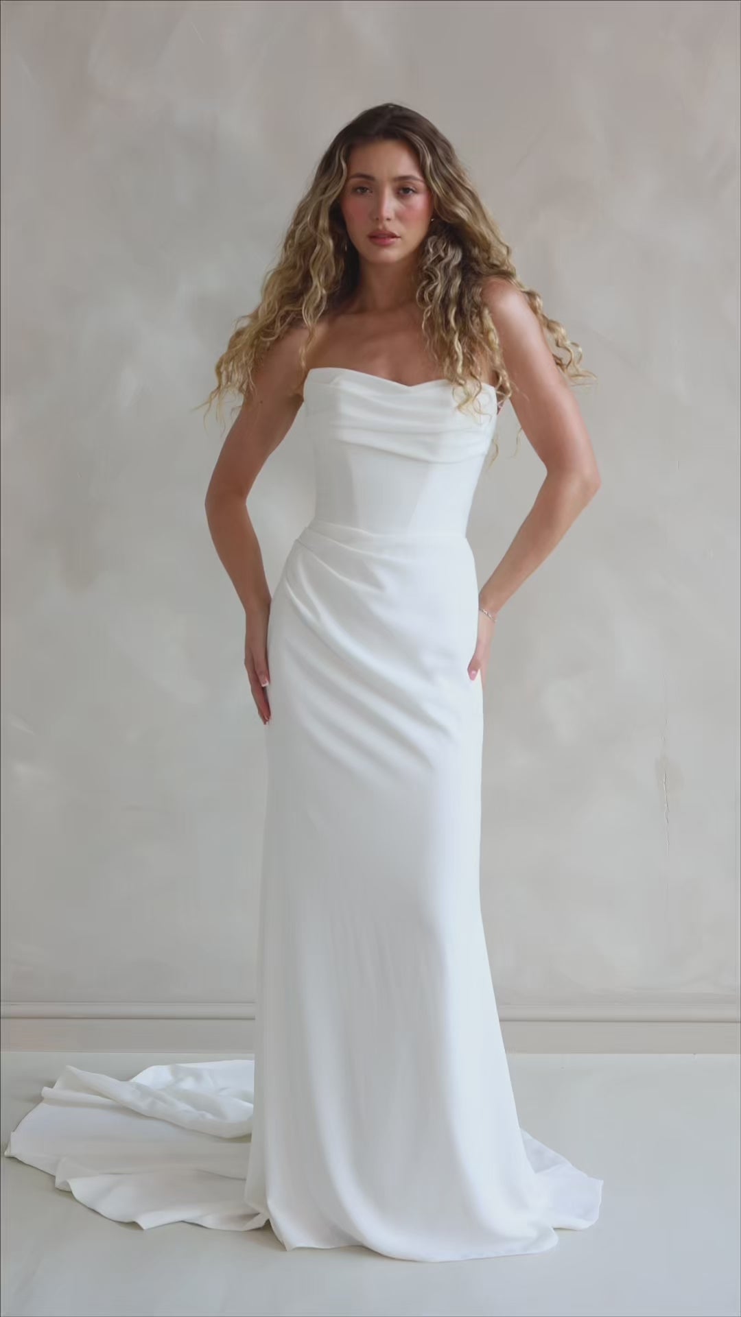 Bride wearing the Maple crepe wedding dress with ruched bust and corseted bodice.